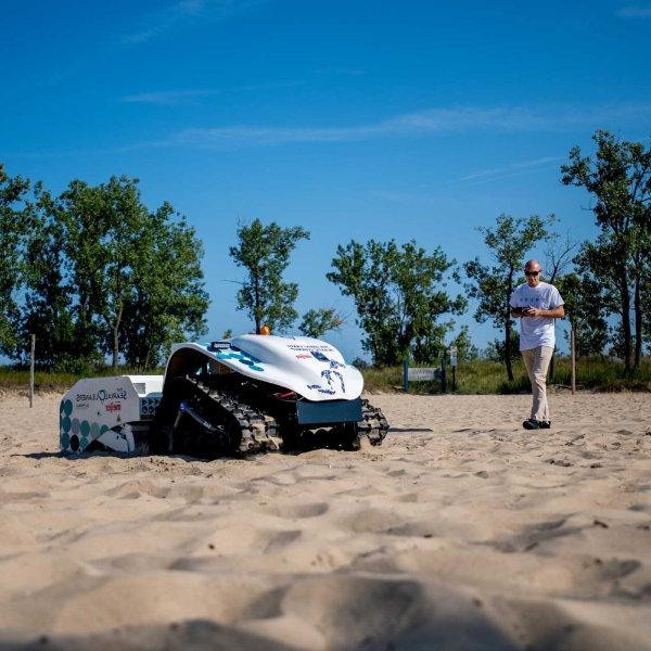 A drone combs a beach for plastic and litter.